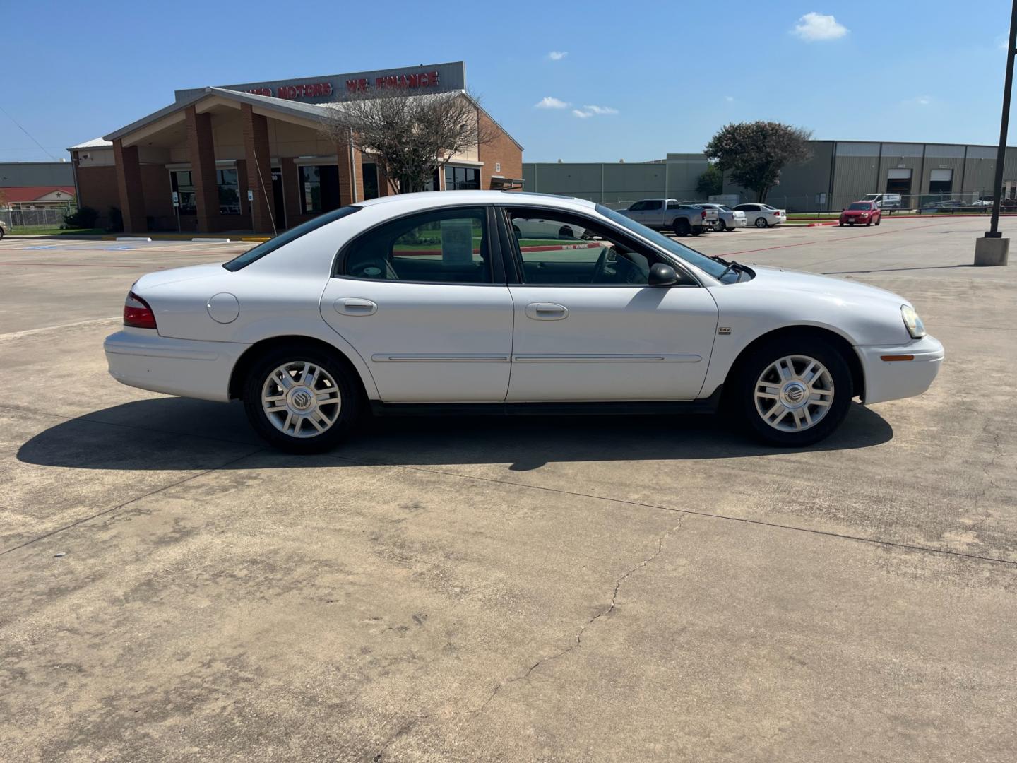 2004 white /TAN Mercury Sable LS Premium (1MEHM55S54A) with an 3.0L V6 SOHC 24V engine, 4-Speed Automatic Overdrive transmission, located at 14700 Tomball Parkway 249, Houston, TX, 77086, (281) 444-2200, 29.928619, -95.504074 - Photo#7